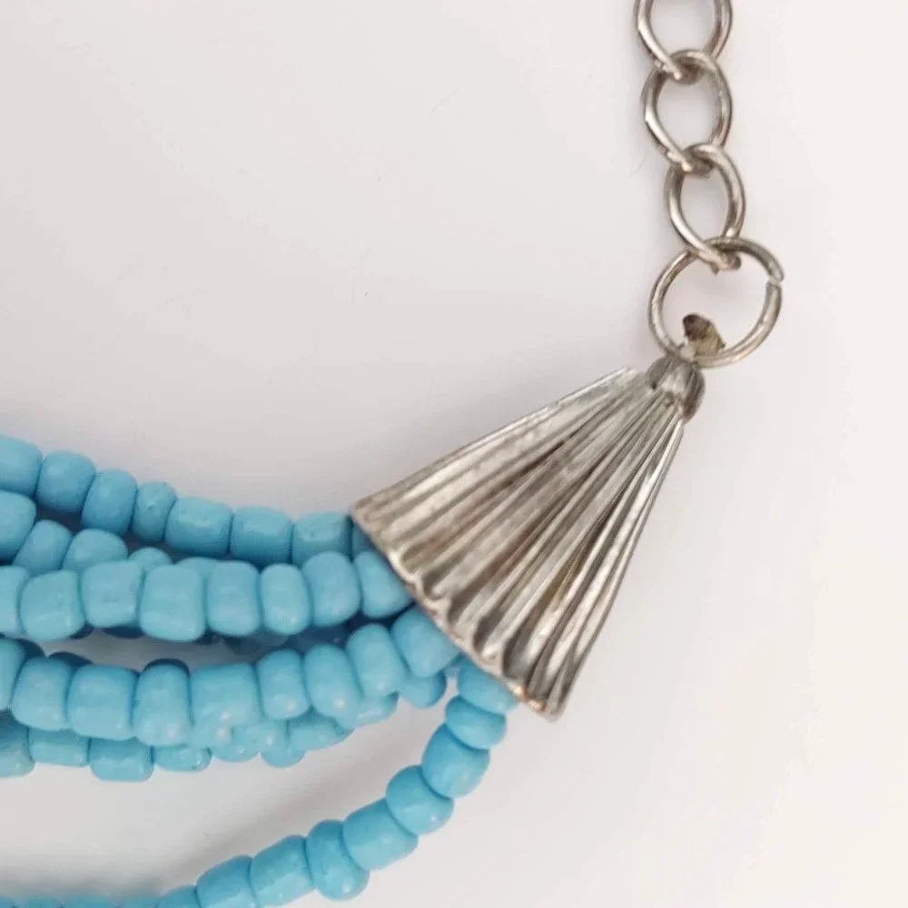 8 strand blue and silver beaded necklace